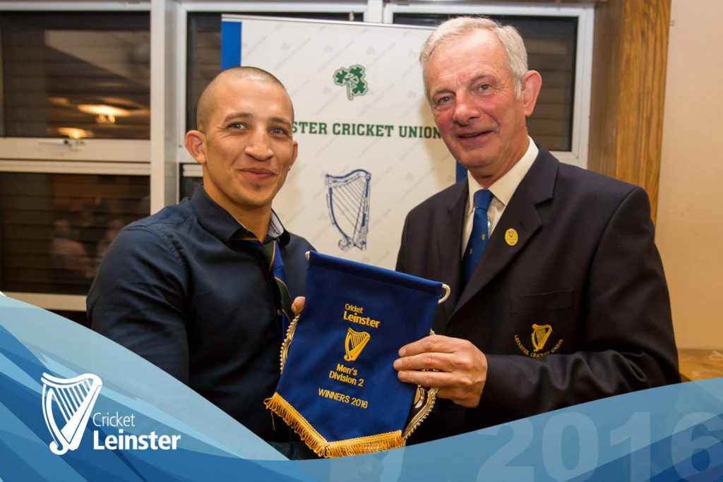 Ross Durity receives the Division 2 trophy from LCU President Roland Bradley